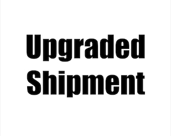 May include: Black and white text on a white background that reads "Upgraded Shipment".