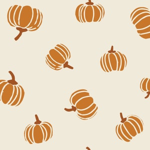 May include: A repeating pattern of stylized pumpkins in shades of brown and orange on a cream background. The pumpkins vary in size and orientation, with visible stems and ribbed details, creating a fall or harvest theme.