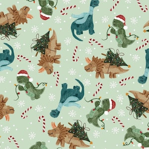 May include: A repeating pattern featuring various dinosaurs in a Christmas theme. The dinosaurs are in shades of green, brown, and blue, wearing Santa hats, scarves, and carrying Christmas trees. Candy canes and snowflakes are scattered across a light green background.