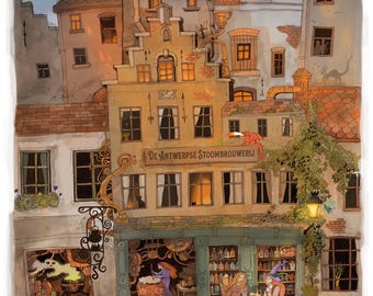 May include: An illustration of a whimsical brewery with the text "De Antwerpse Stoom Brouwerij". The scene depicts a building with multiple stories, a shop with bottles, and people enjoying drinks. A green dragon and other fantasy creatures are also present.