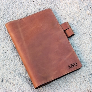 Leather notebook cover, handmade to fit your notebook, which you can personalize with any image engraved and your initials or name