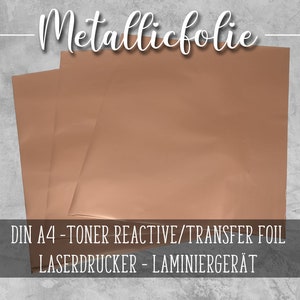 Könnte beinhalten: Drei Blätter Metallicfolie in Roségold, beschriftet mit "DIN A4 - TONER REACTIVE/TRANSFER FOIL LASERDRUCKER - LAMINIERGÉRÄT"