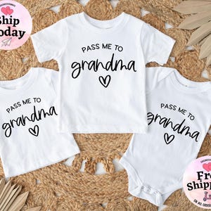 May include: Three white shirts with the text "Pass me to grandma" and a heart design. The shirts are in different sizes, one is a bodysuit.