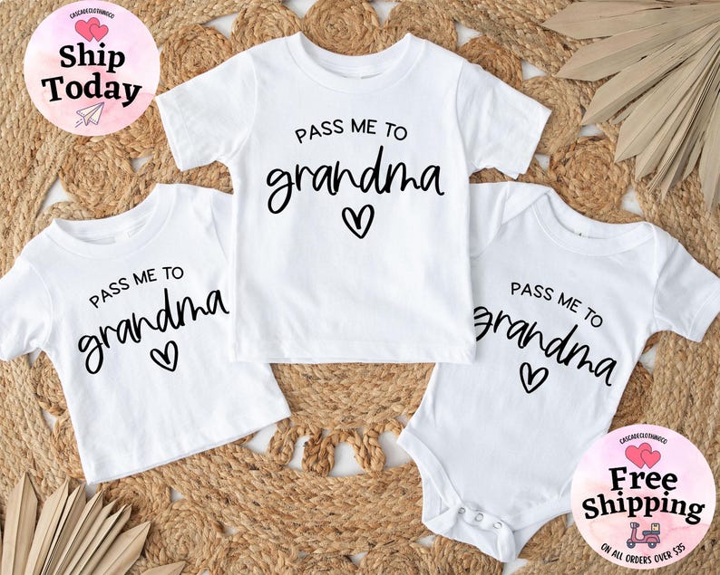 May include: Three white shirts with the text "Pass me to grandma" and a heart design. The shirts are in different sizes, one is a bodysuit.