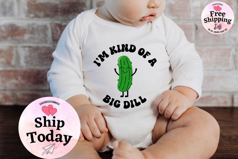 May include: White long-sleeve baby onesie with a green cartoon pickle and the text "I'm kind of a big dill".