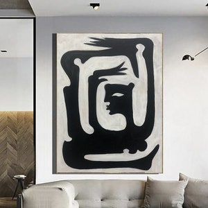 Arte de pared abstracto con líneas faciales en blanco y negro