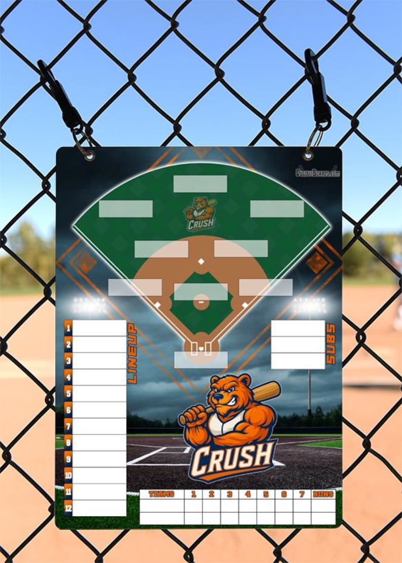 May include: A baseball lineup and substitution board with a baseball field design. The board features a cartoon bear holding a bat, the word "CRUSH", and spaces for lineup, subs, and scores. The background is a baseball field.