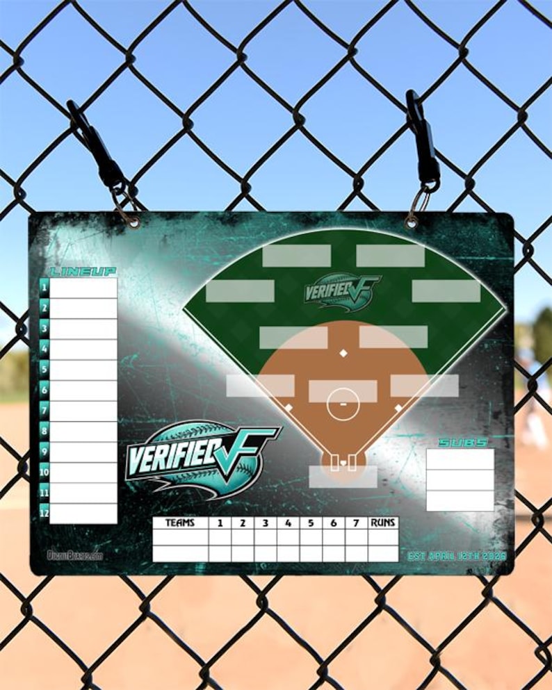 May include: A baseball lineup and score board with a teal and green design. The board features a baseball field diagram, team lineup slots, and spaces for runs. The "VERIFIED" logo is prominently displayed. The board is hanging on a chain-link fence.
