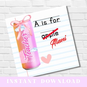 May include: A pink and orange Teacher Fuel energy drink can with a pink bow and the words "Teacher Fuel Energy". A paper with the text "A is for Alani" and a pink heart.