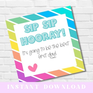May include: A colorful printable sign with the words "SIP SIP HOORAY!" in light blue bubble letters. The sign also includes the text "It's going to be the best first day!" and a pink heart. The sign has a rainbow border.