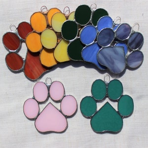 Small stained-glass paw print with heart shape, multiple colors