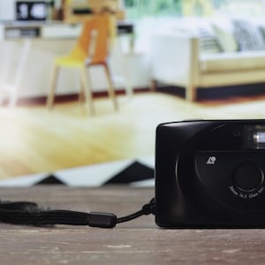 May include: A black YASHICA  Auto Focus