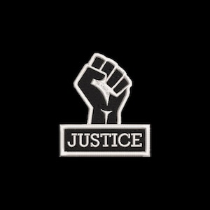 May include: Black and white embroidered patch with a raised fist and the word "JUSTICE" in a banner below.