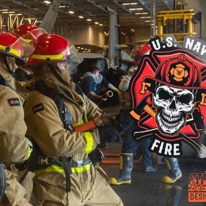 May include: A red and black sticker with a skull and crossbones design. The sticker says "U.S. Navy Fire" and has a firefighter helmet with the letters "F.D." on it.