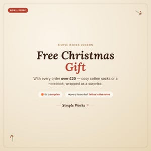 May include: A cream-colored promotional graphic with dark brown and red text reading Simple Works London, Free Christmas Gift, With every order over &pound;20 &mdash; cosy cotton socks or a notebook, wrapped as a surprise. Includes buttons: It's a surprise and Have a favourite? Tell us in the notes.