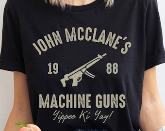 John McClane's Machine Guns shirt, Die hard is a Christmas movie, funny yippee ki yay Nakatomi plaza 1988, Hans Gruber ho ho ho matching tee