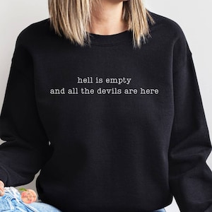 May include: Black sweatshirt with the text "hell is empty and all the devils are here" in white.