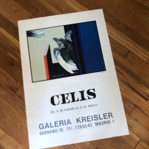 May include: A poster with the name "CELIS" in bold black letters. The poster features an abstract painting with a black bird-like figure and blue and red geometric shapes. The text "GALERIA KREISLER" and address are also visible.