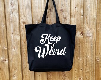 Keep it Weird font large tote bag. True Crime gift for podcast fans. Made from premium black cotton.