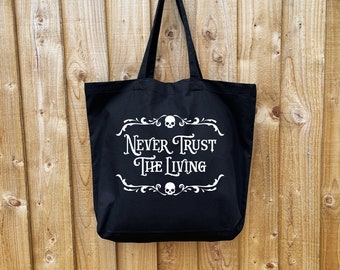 Never Trust The Living tote bag. Gothic premium black cotton large handbag. Alternative goth gift with film quote & skulls. Shopper life.