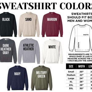 May include: Image displaying sweatshirt colours: black, sand, maroon, dark heather grey, athletic heather, white, navy, and military green. Includes a diagram with measurements in inches and a size chart.