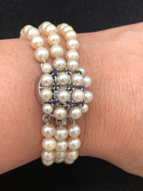 Vintage 14K gold triplestrand pearl bracelet with bl… Gem