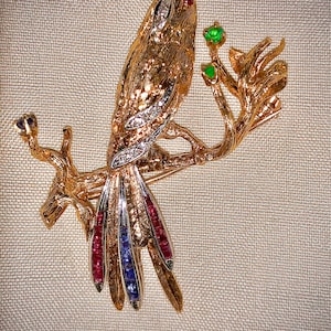 Vintage Cherny 18k yellow and white gold bird pin with diamonds, rubies and blue sapphires and an emerald