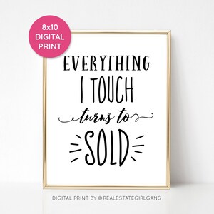 May include: A white printable sign with black text that reads "Everything I touch turns to SOLD". The sign is framed in gold and has the text "Digital Print by @realestategirlgang" at the bottom.