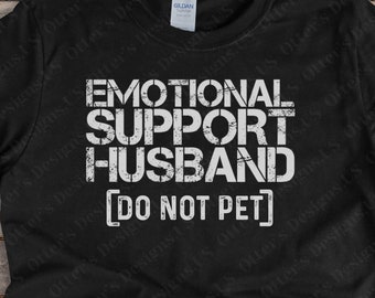 May include: Black t-shirt with white text that reads "Emotional Support Husband [Do Not Pet]"