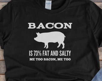 May include: Black t-shirt with a white pig illustration and the text "BACON IS 73% FAT AND SALTY ME TOO BACON, ME TOO".