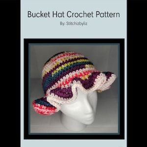 May include: A colorful crocheted bucket hat with a ruffled brim. The hat is made with pink, purple, teal, yellow, and white yarn.