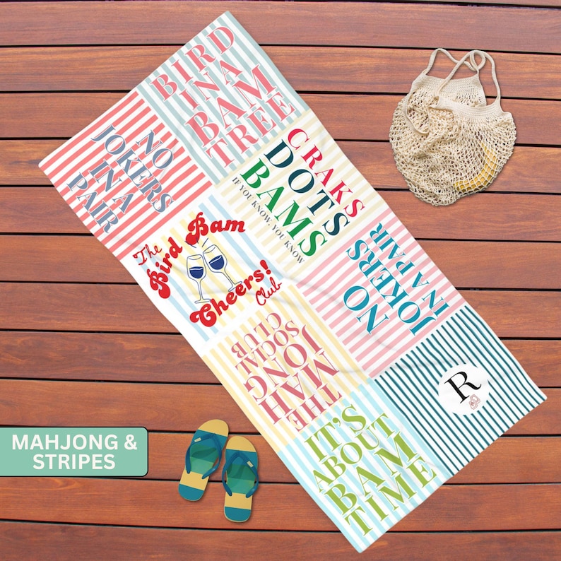 May include: A rectangular beach towel featuring vertical stripes in various pastel colors and multiple text designs including "Bird in a Bam Tree," "No Jokers in a Pair," "Dots Bams," "The Bird Bam Cheers! Club," "The Mah Jong Social Club," and "It's About Bam Time."