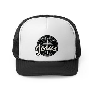 May include: Black and white trucker hat with a black and white logo that says "Victory in Jesus" with a cross and the scripture "1 Cor. 15:57".