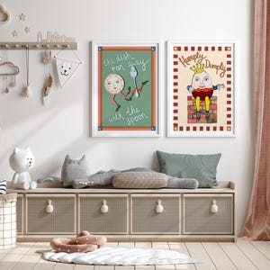 May include: Two framed nursery art prints. One features a plate and spoon with the text "the dish ran away with the spoon." The other print shows Humpty Dumpty sitting on a wall.