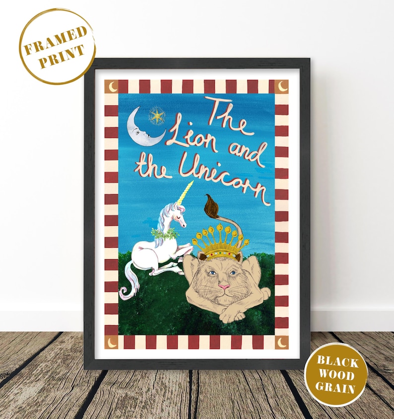 May include: Framed print featuring a whimsical illustration of a lion and a unicorn. The artwork has a blue background with the title "The Lion and the Unicorn" in cursive. The lion wears a crown, and the unicorn has a golden horn. The frame is black.