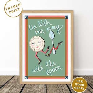 May include: A framed print featuring a whimsical illustration of a plate and spoon with legs, running away together. The text "the dish ran away with the spoon" is written in a playful font. The artwork is set against a green background with a pink border.