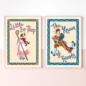 May include: Two framed art prints. One features Little Bo Peep in a pink dress with a staff, the other shows The Knave of Hearts running. Both have decorative borders with text.