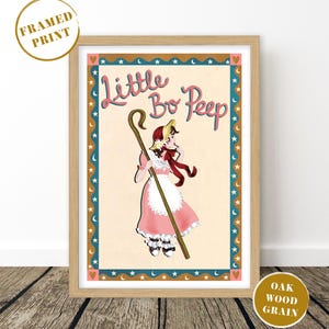 May include: Framed print featuring a whimsical illustration of Little Bo Peep in a pink dress, holding a shepherd's crook. The artwork has a vintage aesthetic, with a light beige background and a decorative border of stars and moons. The frame is oak wood grain.