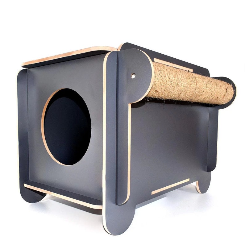 May include: A dark gray cat house with a round entrance and a scratching post on top. The scratching post is covered in natural sisal rope.