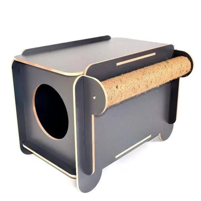 May include: A black cat bed with a scratching post made of sisal rope. The bed has a round opening for the cat to enter.