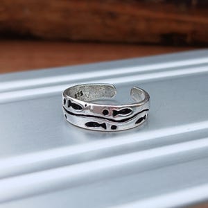 Justerbar tåring i sterlingsilver med fiskar och vågor