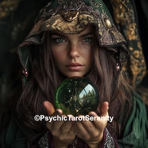 May include: A woman with long brown hair and green eyes, wearing a green hooded cloak, holds a green crystal ball. The image has the text "©PsychicTarotSerenity" at the bottom. The overall theme is mystical and spiritual.