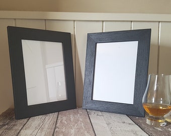 Pair of Black 7x5 Photo Frames. Solid wood stained with natural woodgrain. Freestanding or wall mounted small picture frames for photographs