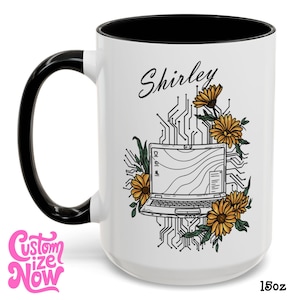 May include: White ceramic mug with a black handle and interior. The mug features a floral design with a laptop illustration, the name "Shirley", and the text "Custom Size Now". The mug is 15oz.