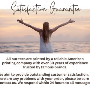 a woman standing on a beach with her arms outstretched