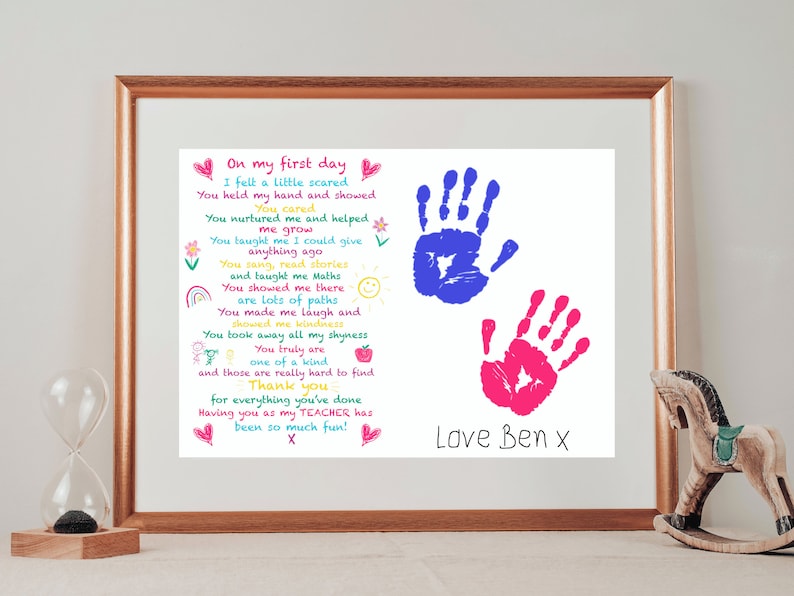 May include: A framed print with a hand-drawn poem about a teacher. The poem is written in colorful text and includes two handprints, one blue and one pink. The print is signed "Love Ben x".