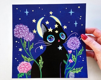 May include: A black cat with large blue eyes sits under a crescent moon with stars. The cat is surrounded by purple and pink flowers with green leaves against a dark blue background. The image is signed "Sara Sew 2022".