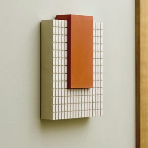 Brutalist Mid-century style wall sculptures in warm white and burnt orange.