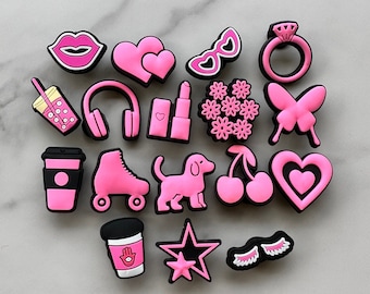 hot pink and black charms for your crocs, croc compatible black and pink shoe charms, trending shoe charms, butterfly, fist