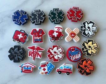 May include: A collection of 18 colorful medical themed shoe charms. The charms feature various symbols, including the Star of Life, a stethoscope, a heart, a bandage, a pill bottle, a graduation cap, and a skull and crossbones. The charms are made of a soft, flexible material and are perfect for adding a touch of personality to your shoes.